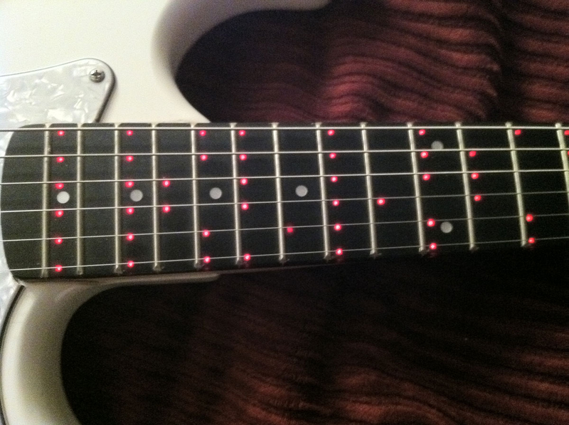 Illustration for article titled The Fretlight Guitar Sets a Shining Example for Hopeful Guitar Heroes